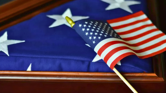 American flag in wooden triangle display case