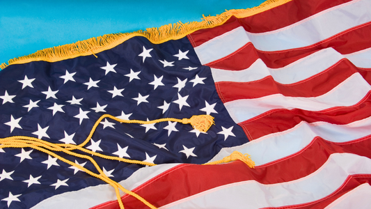 American flag with gold fringe