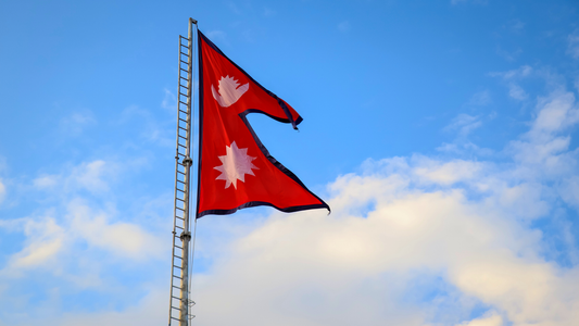 Nepal country flag with it's double-pennon shape clearly visible.