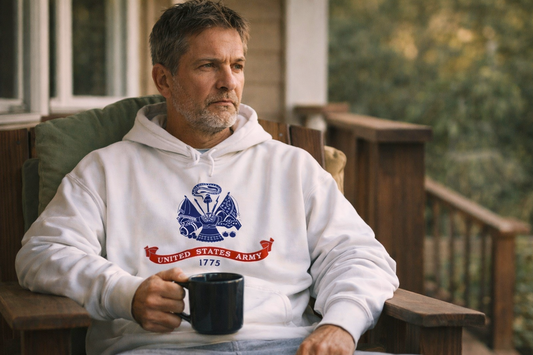 Bearded man sitting on porch wearing a military flag hoodie