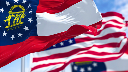 Close-up of Georgia state flag hanging next to the US Flag