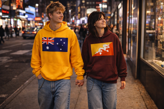 Couple walking down the street. One wearing an Australian hoodie the other wearing a Bhutan hoodie