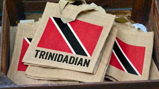Trinidadian Flag Tote bags in a wooden storage box as you would find in a gift shop selling souvenirs.