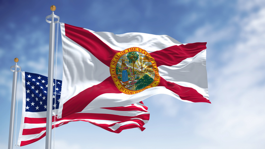 Florida State Flag flying proud next to the USA Flag