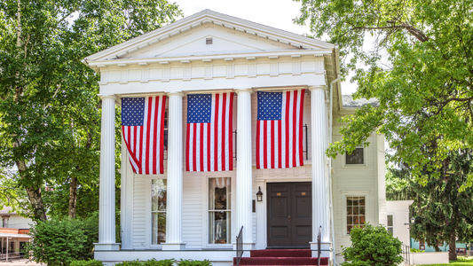 Residential home displaying 3 US flags