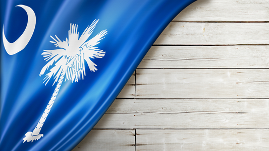 South Carolina Flag draped over white wooden slats