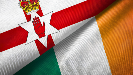 Two folded Ireland Flags - The Irish Tricolor and the Ulster Banner
