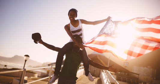 Two people celebrating with the American Flag