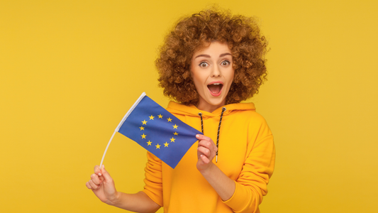 Woman wearing urban style hoodie holding EU flag