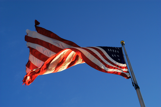 Worn out American Flag Flying on Flag Pole