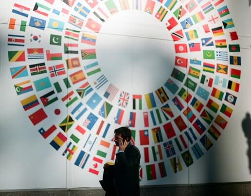 national flags of many countries on a wall
